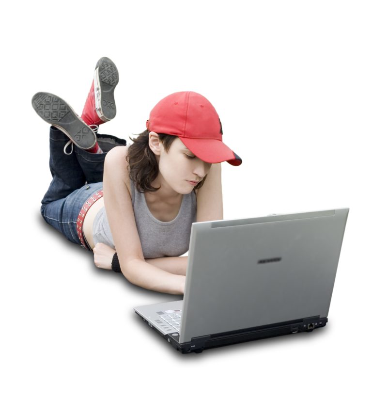 teen working on a laptop